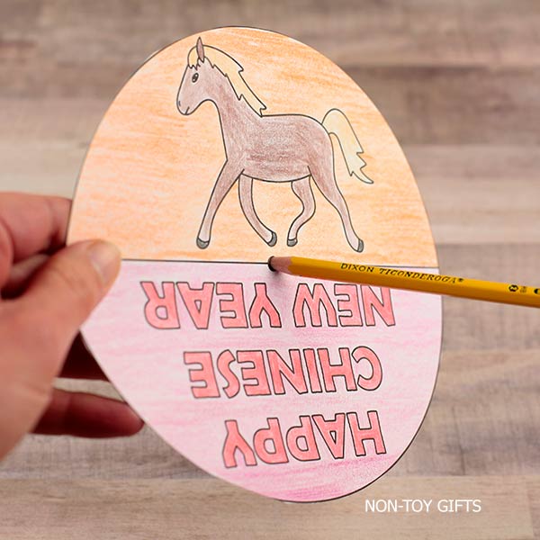 Printable Chinese New Year spinner with horse illustration and Happy Chinese New Year 2026 text