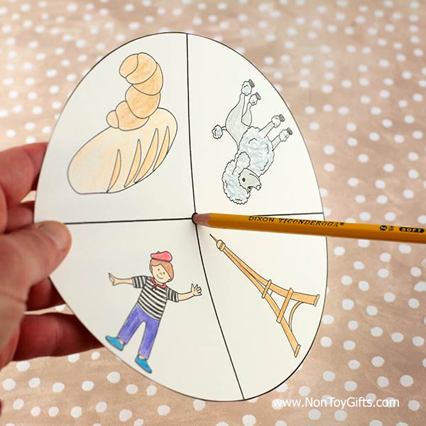 easy France craft with French symbols: Eiffel tower, croissant, baguette, French poodle, boy with beret