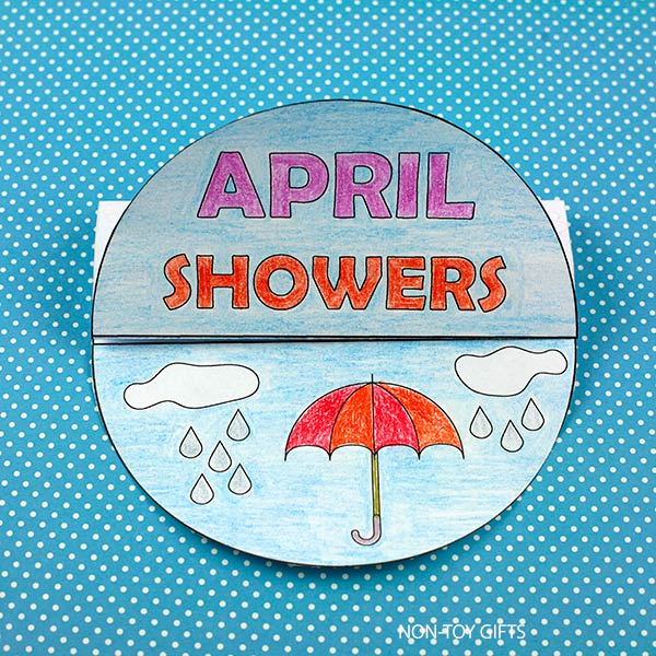 Easy kids craft printable for spring featuring April Showers folded paper craft with rainbow flowers and umbrella design for preschool and kindergarten