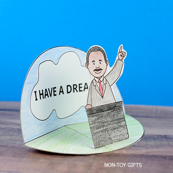 Kids assembling a Martin Luther King Jr. diorama craft printable using paper and glue