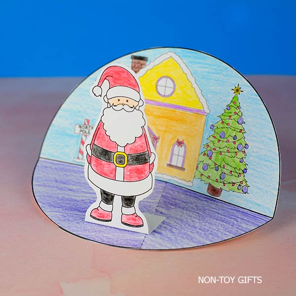 Hands-on Christmas craft for children featuring a DIY Santa diorama made from paper