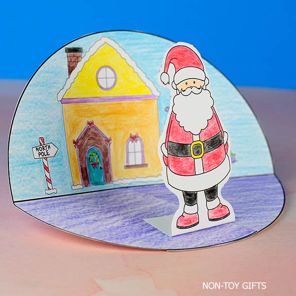 Printable Santa diorama template colored and folded into a festive Christmas scene for kids