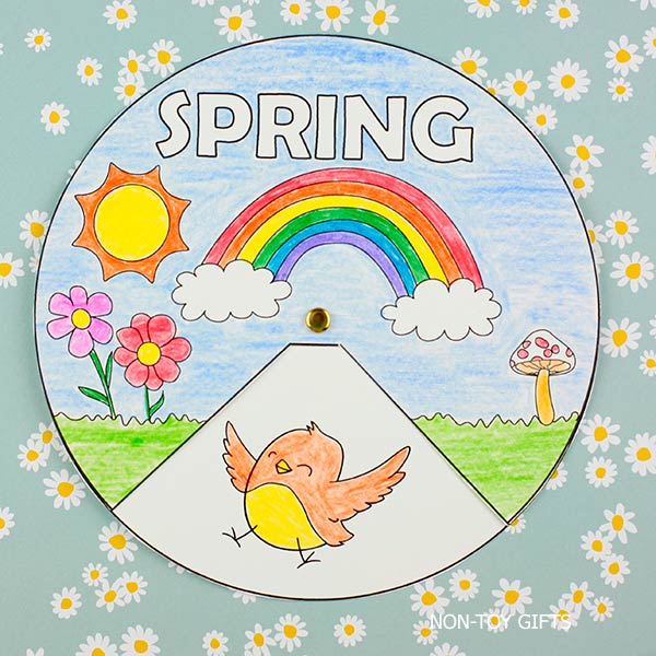 Spring spinner craft printable with rainbow, flowers, bunny, bird, and umbrella